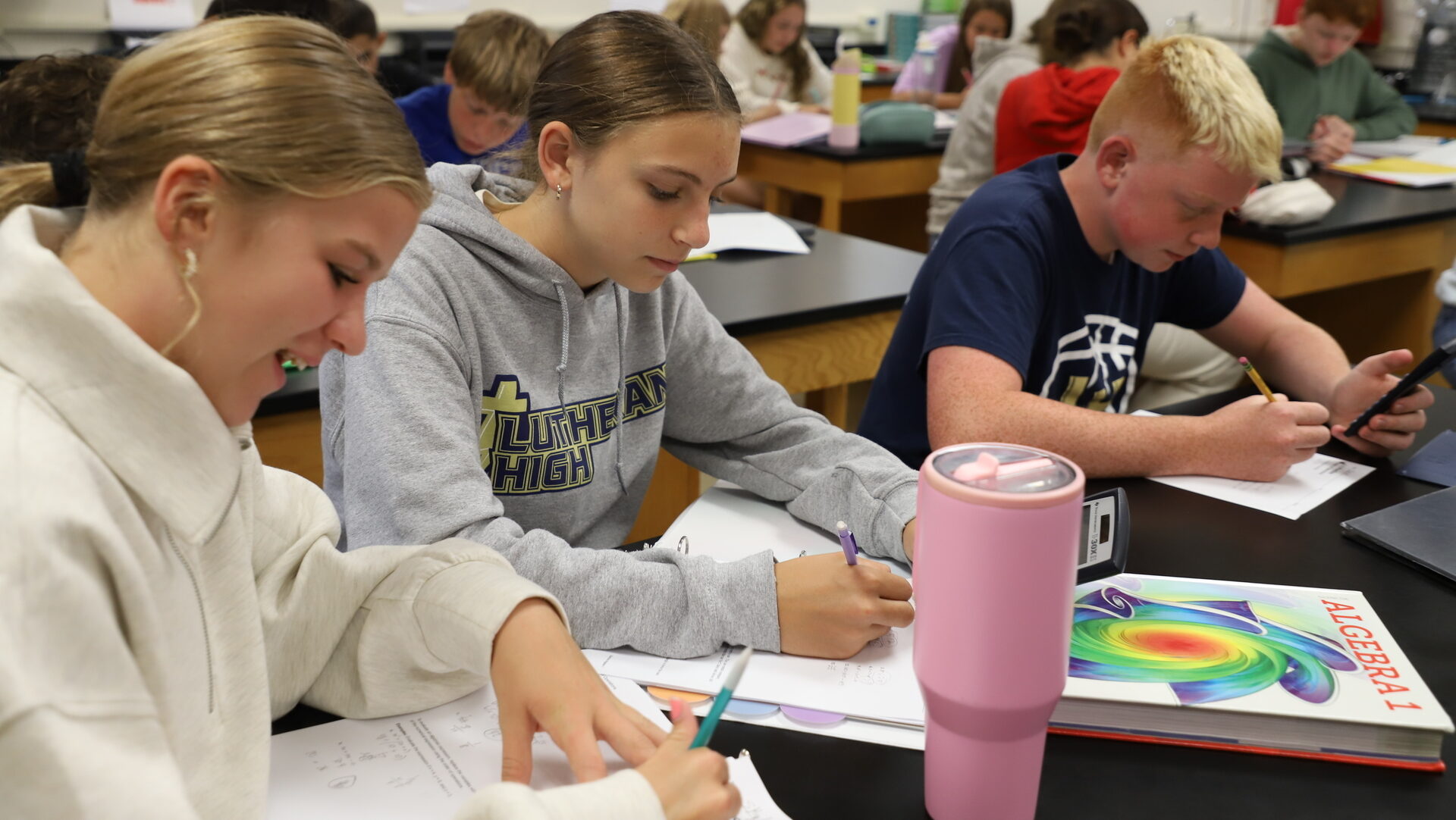 Students engaged in academic learning at CNLS