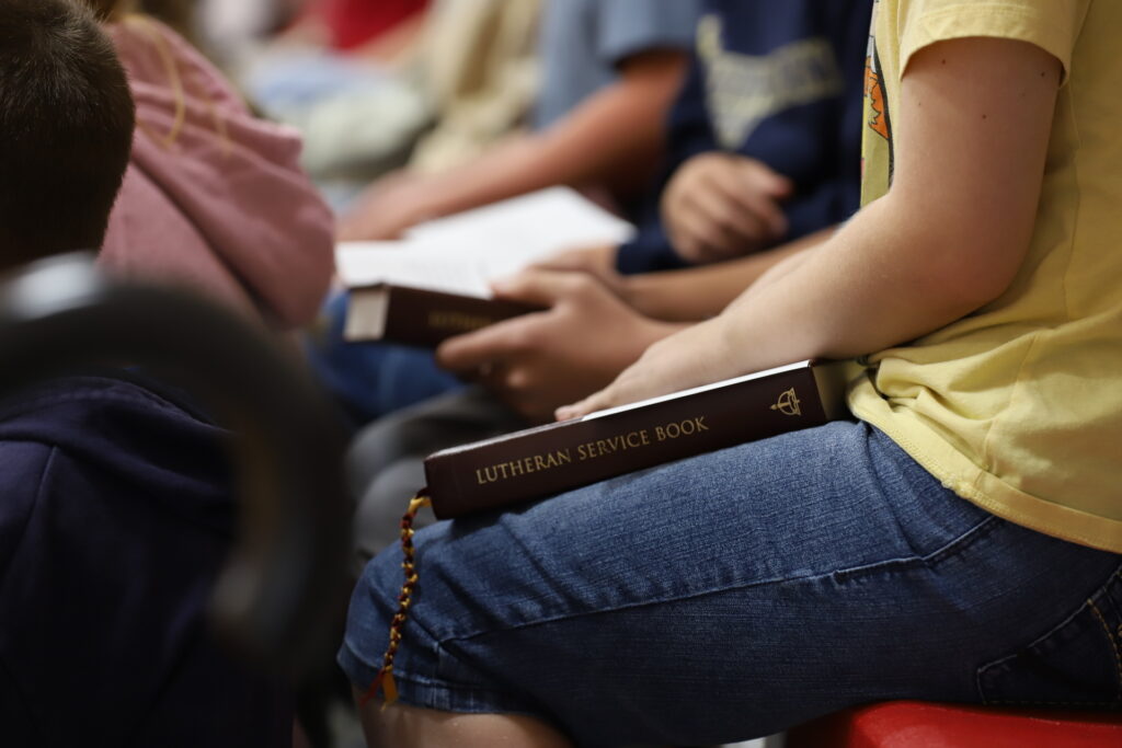 Student holding a bible. 